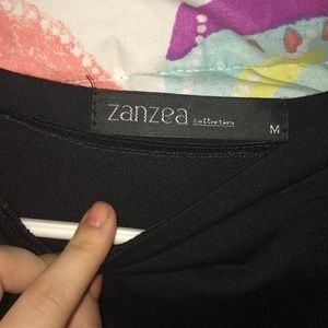 Black croptop with ripped slits down the sleeves